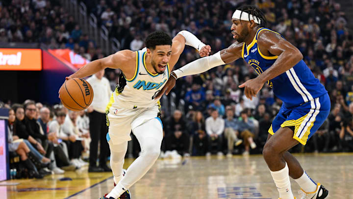 Indiana Pacers guard Tyrese Haliburton (0) drives to the basket against Golden State Warriors guard Buddy Hield. Indiana Pacers guard Tyrese Haliburton (0) drives to the basket against Golden State Warriors guard Buddy Hield.