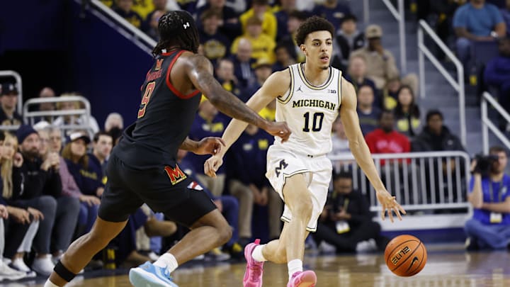 Mar 5, 2025; Ann Arbor, Michigan, USA;  Michigan Wolverines guard Justin Pippen (10) dribbles defended by Maryland Terrapins guard Selton Miguel (9) in the first half at Crisler Center. Mandatory Credit: Rick Osentoski-Imagn Images