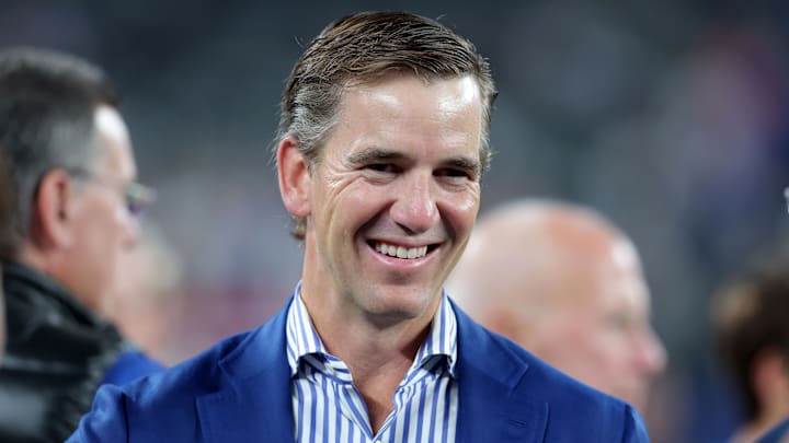 Oct 13, 2024; East Rutherford, New Jersey, USA; New York Giants former quarterback Eli Manning on the field before a game against the Cincinnati Bengals at MetLife Stadium.  