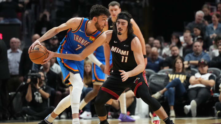 Thunder forward Chet Holmgren (7) looks to pass the ball as Miami Heat guard Jaime Jaquez Jr. (11) defends. Thunder forward Chet Holmgren (7) looks to pass the ball as Miami Heat guard Jaime Jaquez Jr. (11) defends.