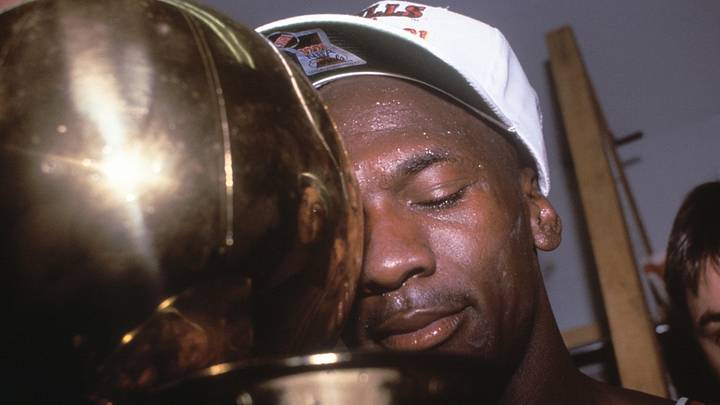 Jun 12, 1991; Los Angeles, CA, USA: FILE PHOTO; Chicago Bulls guard Michael Jordan hugs the championship trophy Jun 12, 1991; Los Angeles, CA, USA: FILE PHOTO; Chicago Bulls guard Michael Jordan hugs the championship trophy