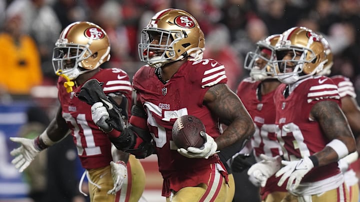 San Francisco 49ers linebacker Dre Greenlaw (57) celebrates his interception during the third quarter.