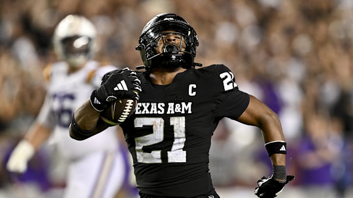 Oct 26, 2024; College Station, Texas, USA; Texas A&M Aggies linebacker Taurean York (21) reacts after catching the ball for an interception in the fourth quarter against the LSU Tigers at Kyle Field. Mandatory Credit: Maria Lysaker-Imagn Images. 