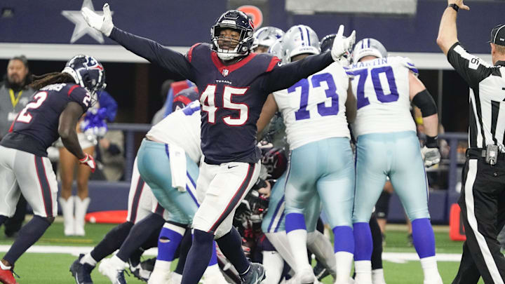 Dec 11, 2022; Arlington, Texas, USA; Houston Texans linebacker Ogbonnia Okoronkwo (45) reacts after a turnover by the Dallas Cowboys during the second half at AT&T Stadium. Mandatory Credit: Raymond Carlin III-Imagn Images
