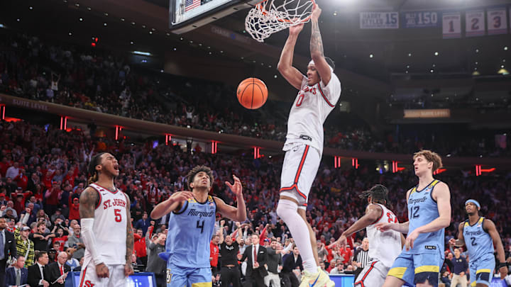 Feb 4, 2025; New York, New York, USA;  St. John's basketball guard Aaron Scott (0) dunks in the second half against the Marquette Golden Eagles at Madison Square Garden.