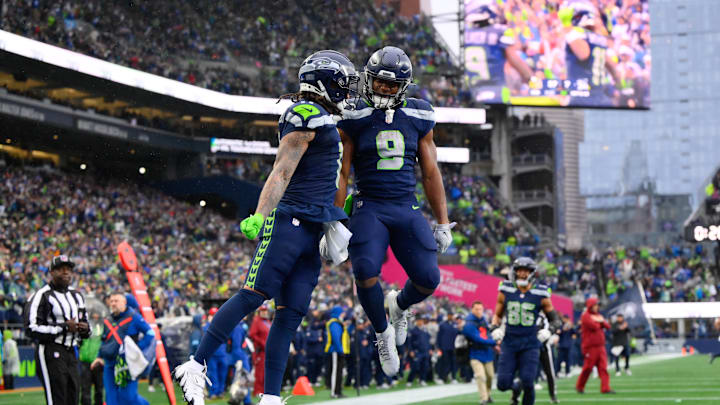 Dec 22, 2024; Seattle, Washington, USA; Seattle Seahawks wide receiver Jaxon Smith-Njigba (11) and running back Kenneth Walker III (9) celebrate after Jaxon Smith-Njigba scored a touchdown against the Minnesota Vikings during the first half at Lumen Field. Mandatory Credit: Steven Bisig-Imagn Images Dec 22, 2024; Seattle, Washington, USA; Seattle Seahawks wide receiver Jaxon Smith-Njigba (11) and running back Kenneth Walker III (9) celebrate after Jaxon Smith-Njigba scored a touchdown against the Minnesota Vikings during the first half at Lumen Field. Mandatory Credit: Steven Bisig-Imagn Images