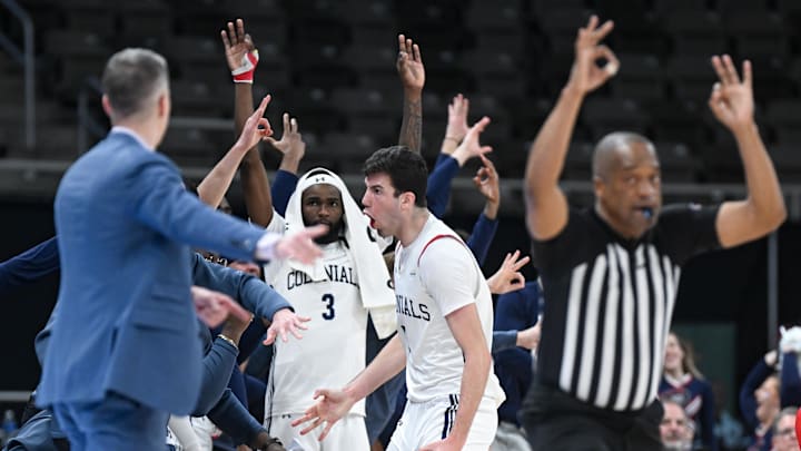 Mar 11, 2025; Indianapolis, IN, USA; Robert Morris Colonials forward Alvaro Folgueiras (7) celebrates after making a three-point basket during the second half against the Youngstown State Penguins at Corteva Coliseum. Mandatory Credit: Robert Goddin-Imagn Images