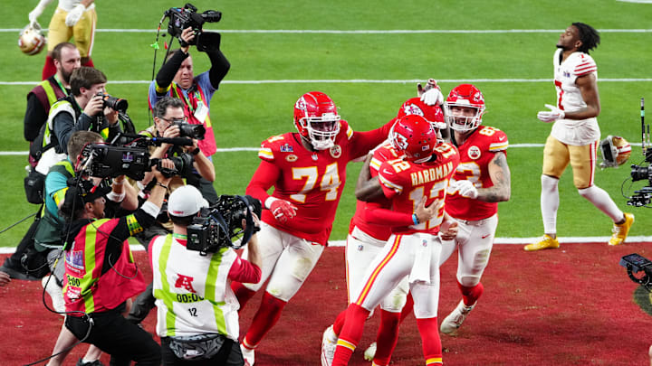 Feb 11, 2024; Paradise, Nevada, USA;  Kansas City Chiefs wide receiver Mecole Hardman Jr. (12) celebrates after scoring the winning touchdown against the San Francisco 49ers during overtime in Super Bowl LVIII at Allegiant Stadium. Mandatory Credit: Stephen R. Sylvanie-Imagn Images