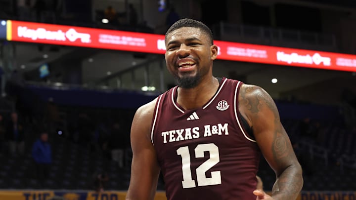 Dec 2, 2025; Pittsburgh, Pennsylvania, USA;  Texas A&M Aggies forward Rashaun Agee (12) reacts after defeating the Pittsburgh Panthers at the Petersen Events Center. Mandatory Credit: Charles LeClaire-Imagn Images