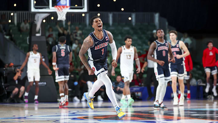 Nov 29, 2024; Paradise Island, Bahamas, BHS;  Arizona Wildcats guard Caleb Love (1) reacts after scoring during the second half against the West Virginia Mountaineers at Imperial Arena at the Atlantis resort.  Mandatory Credit: Kevin Jairaj-Imagn Images