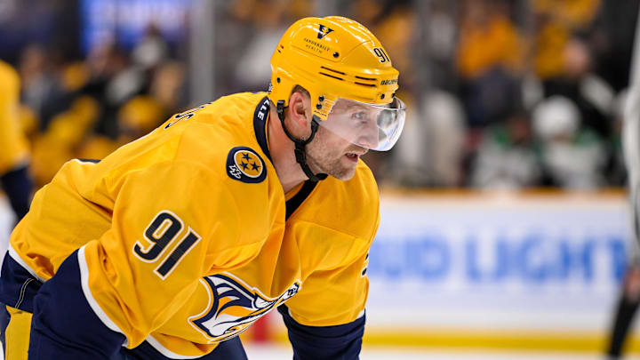 Oct 10, 2024; Nashville, Tennessee, USA;   Nashville Predators center Steven Stamkos (91) awaits the face off against the Dallas Stars during the first period at Bridgestone Arena. Mandatory Credit: Steve Roberts-Imagn Images