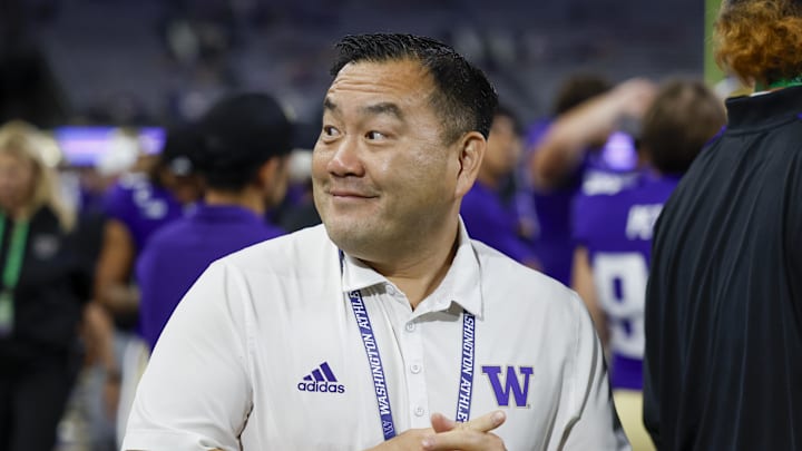 Aug 31, 2024; Seattle, Washington, USA; Washington Huskies athletic director Pat Chun stands on the sideline during the fourth quarter against the Weber State Wildcats at Alaska Airlines Field at Husky Stadium. Mandatory Credit: Joe Nicholson-Imagn Images