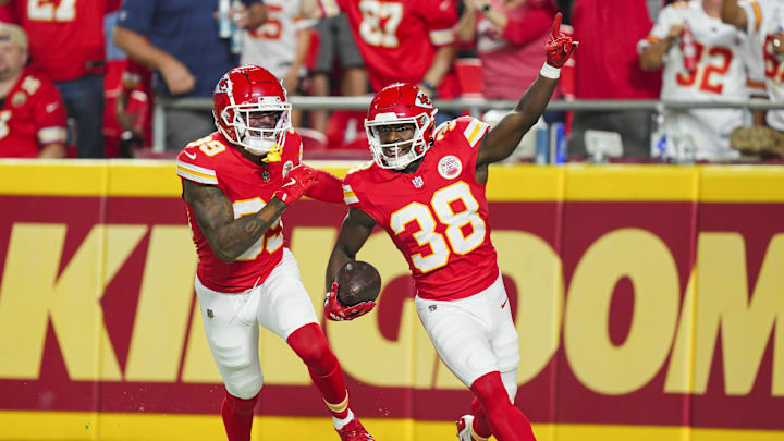 Aug 22, 2024; Kansas City, Missouri, USA; Kansas City Chiefs cornerback D.J. Miller Jr. (38) celebrates with cornerback Keith Taylor Jr. (39) after a play during the second half against the Chicago Bears at GEHA Field at Arrowhead Stadium. Mandatory Credit: Jay Biggerstaff-Imagn Images