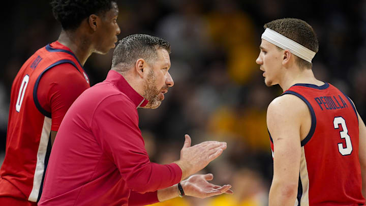 Jan 25, 2025; Columbia, Missouri, USA; Mississippi Rebels head coach Chris Beard talks with guard Sean Pedulla (3) during the first half against the Missouri Tigers at Mizzou Arena. Mandatory Credit: Jay Biggerstaff-Imagn Images Jan 25, 2025; Columbia, Missouri, USA; Mississippi Rebels head coach Chris Beard talks with guard Sean Pedulla (3) during the first half against the Missouri Tigers at Mizzou Arena. Mandatory Credit: Jay Biggerstaff-Imagn Images