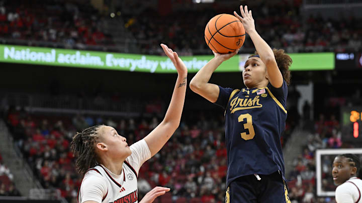 Mar 1, 2026; Louisville, Kentucky, USA;  Notre Dame Fighting Irish guard Hannah Hidalgo (3) shoots against Louisville Cardinals guard Imari Berry (2) during the second half at KFC Yum! Center. Notre Dame defeated Louisville 65-62. Mandatory Credit: Jamie Rhodes-Imagn Images