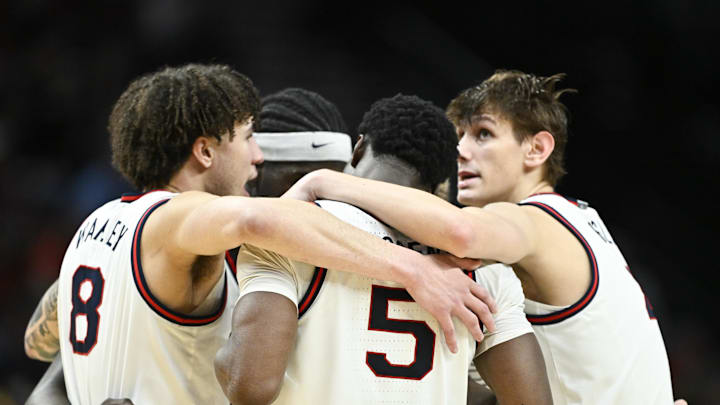 Mar 19, 2026; Portland, OR, USA; Gonzaga Bulldogs guard Jalen Warley (8) and forward Emmanuel Innocenti (5) huddle with teammates during the second half of a first round game of the men's 2026 NCAA Tournament against the Kennesaw State Owls at Moda Center.