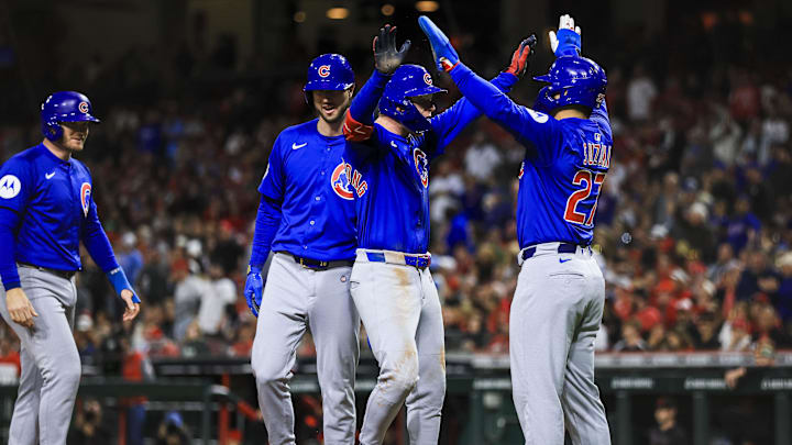 May 23, 2025; Cincinnati, Ohio, USA; Chicago Cubs outfielder Pete Crow-Armstrong (4) reacts with outfielder Seiya Suzuki (27) after hitting a grand slam in the seventh inning against the Cincinnati Reds at Great American Ball Park. Mandatory Credit: Katie Stratman-Imagn Images