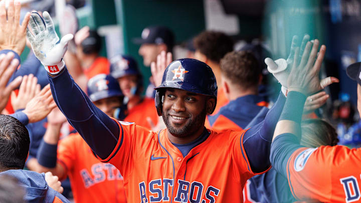 Apr 27, 2025; Kansas City, Missouri, USA; Houston Astros outfielder Yordan Alvarez (44) celebrates in the dugout after hitting a home run during the third inning against the Kansas City Royals at Kauffman Stadium. 