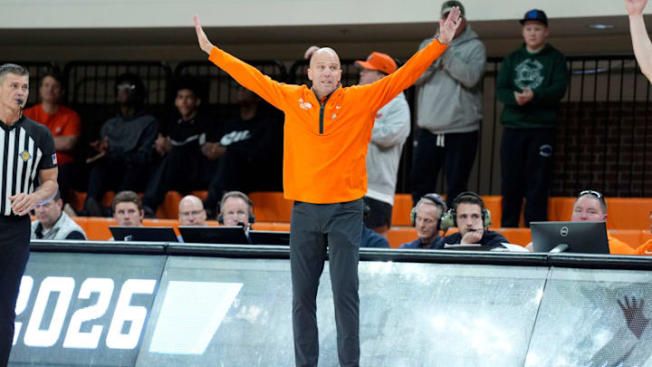 Oklahoma State coach Steve Lutz leaps during a first-round basketball game in the National Invitational between the Oklahoma State Cowboys and the Davidson Wildcats at Gallagher-Iba Arena in Stillwater, Okla., Tuesday, March 17, 2026. Oklahoma State won 84-80.
