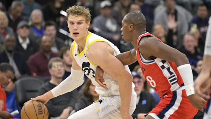 Dec 16, 2024; Inglewood, California, USA;   Utah Jazz forward Lauri Markkanen (23) is defended by Los Angeles Clippers guard Kris Dunn (8) in the first half at Intuit Dome. Mandatory Credit: Jayne Kamin-Oncea-Imagn Images