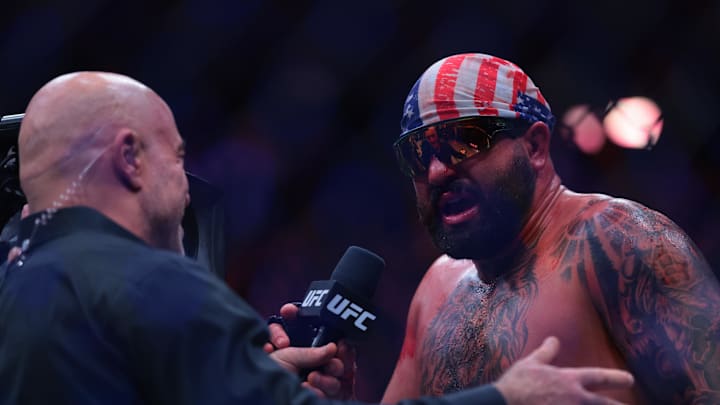 Apr 11, 2026; Miami, Florida, UNITED STATES; Josh Hokit (blue gloves) reacts after the fight against Curtis Blaydes (red gloves) during UFC 327 at Kaseya Center. Mandatory Credit: Sam Navarro-Imagn Images
