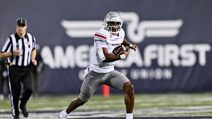 Oct 11, 2024; Logan, Utah, USA; UNLV Rebels quarterback Hajj-Malik Williams (6) runs with the ball against the Utah State Aggies at Merlin Olsen Field at Maverik Stadium. Mandatory Credit: Jamie Sabau-Imagn Images Oct 11, 2024; Logan, Utah, USA; UNLV Rebels quarterback Hajj-Malik Williams (6) runs with the ball against the Utah State Aggies at Merlin Olsen Field at Maverik Stadium. Mandatory Credit: Jamie Sabau-Imagn Images