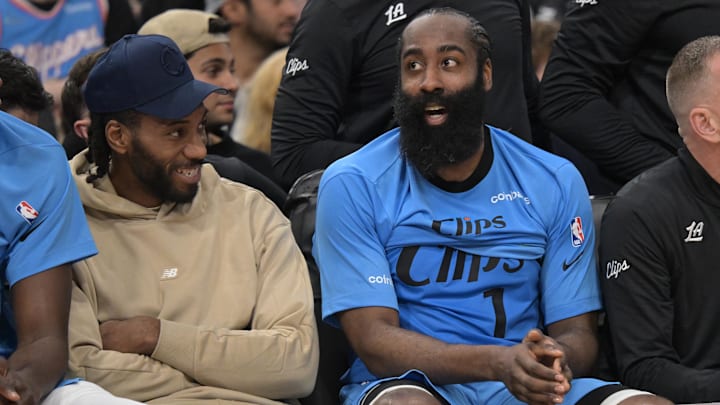 Dec 27, 2024; Inglewood, California, USA; Los Angeles Clippers forward Kawhi Leonard (2) and guard James Harden (1) sit on the bench in the second half against the Golden State Warriors at Intuit Dome. Mandatory Credit: Jayne Kamin-Oncea-Imagn Images