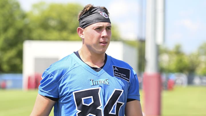 Jul 23, 2025; Nashville, TN, USA; Tennessee Titans tight end Gunnar Helm (84) walks off the field during training camp at Ascension Saint Thomas Sports Park. Mandatory Credit: Steve Roberts-Imagn Images Jul 23, 2025; Nashville, TN, USA; Tennessee Titans tight end Gunnar Helm (84) walks off the field during training camp at Ascension Saint Thomas Sports Park. Mandatory Credit: Steve Roberts-Imagn Images