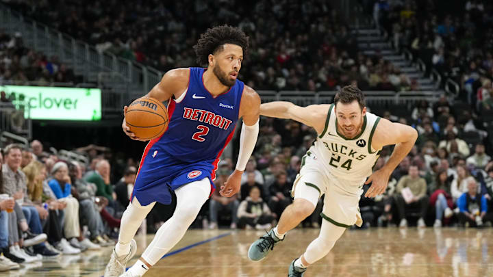 Nov 13, 2024; Milwaukee, Wisconsin, USA;  Detroit Pistons guard Cade Cunningham (2) drives for the basket in front of Milwaukee Bucks guard Pat Connaughton (24) during the third quarter at Fiserv Forum. Mandatory Credit: Jeff Hanisch-Imagn Images