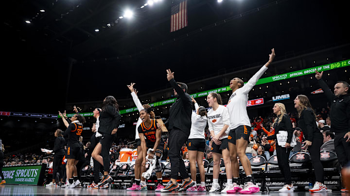 Mar 8, 2025; Kansas City, MO, USA; The Oklahoma State Cowgirls bench celebrates after a play against the Baylor Lady Bears in the second half at T-Mobile Center. Mandatory Credit: Amy Kontras-Imagn Images
