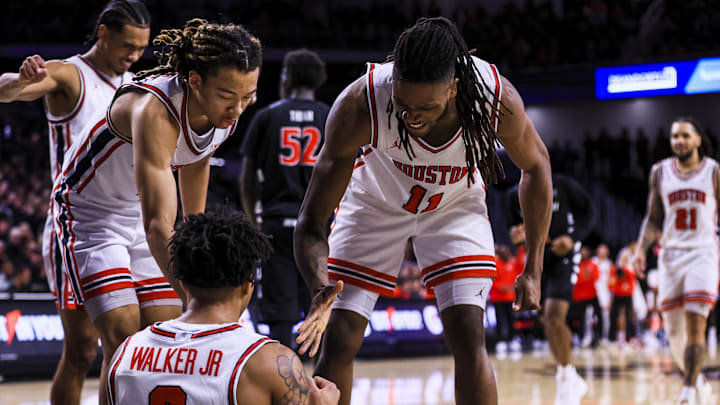 Jan 3, 2026; Cincinnati, Ohio, USA; Houston Cougars forward Joseph Tugler (11) reacts with guard Ramon Walker Jr. (3) after a play in the second half against the Cincinnati Bearcats at Fifth Third Arena. Mandatory Credit: Katie Stratman-Imagn Images Jan 3, 2026; Cincinnati, Ohio, USA; Houston Cougars forward Joseph Tugler (11) reacts with guard Ramon Walker Jr. (3) after a play in the second half against the Cincinnati Bearcats at Fifth Third Arena. Mandatory Credit: Katie Stratman-Imagn Images