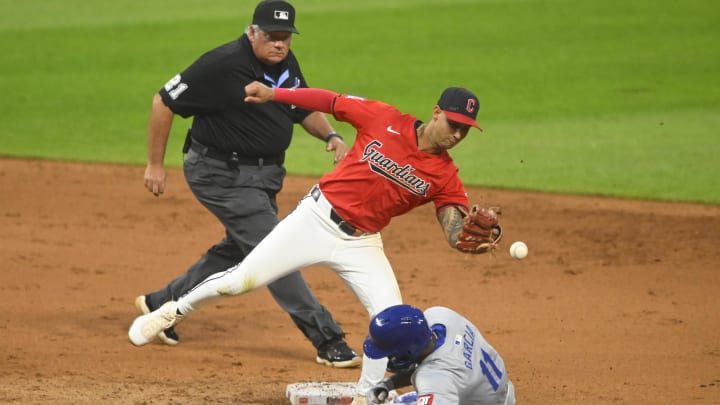 Kansas City Royals second baseman Maikel Garcia (11) steals second base beside Cleveland Guardians shortstop Brayan Rocchio (4) in the fifth inning at Progressive Field on Aug 27.
