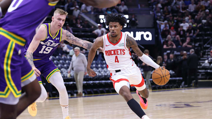 Apr 11, 2024; Salt Lake City, Utah, USA; Houston Rockets guard Jalen Green (4) dribbles past Utah Jazz forward Luka Samanic (19) during the third quarter at Delta Center. Mandatory Credit: Rob Gray-Imagn Images