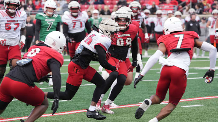 Louisville Duke Watson (26) catches the ball and ran from some yardage against Red Louisville Rodney Johnson (7) in the Spring Game Friday night at L & N Stadium.
April 11, 2025 Louisville Duke Watson (26) catches the ball and ran from some yardage against Red Louisville Rodney Johnson (7) in the Spring Game Friday night at L & N Stadium.
April 11, 2025
