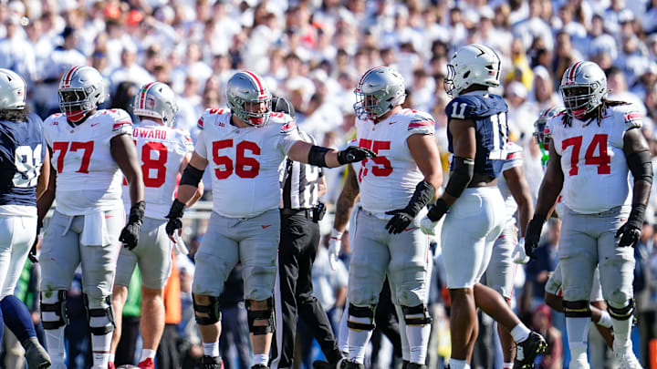 Ohio State Buckeyes offensive linemen, from left, Tegra Tshabola (77), Seth McLaughlin (56), Carson Hinzman (75) and Donovan Jackson (74) line up during the NCAA football game against the Penn State Nittany Lions at Beaver Stadium in University Park, Pa. on Monday, Nov. 4, 2024. Ohio State won 20-13.