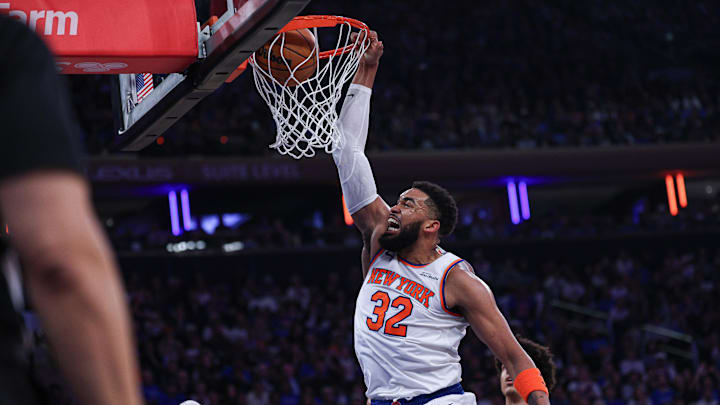 Apr 18, 2026; New York, New York, USA; New York Knicks center Karl-Anthony Towns (32) dunks the ball against the Atlanta Hawks during the first half of the 2026 NBA Playoffs at Madison Square Garden. Mandatory Credit: Vincent Carchietta-Imagn Images