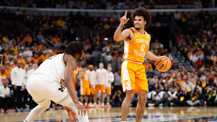 Mar 29, 2026; Chicago, IL, USA; Tennessee Volunteers guard Ja'Kobi Gillespie (0) communicates a play while defended by Michigan Wolverines forward Morez Johnson Jr. (21) in the first half during an Elite Eight game of the Midwest Regional of the men's 2026 NCAA Tournament at United Center. Mandatory Credit: Kamil Krzaczynski-Imagn Images