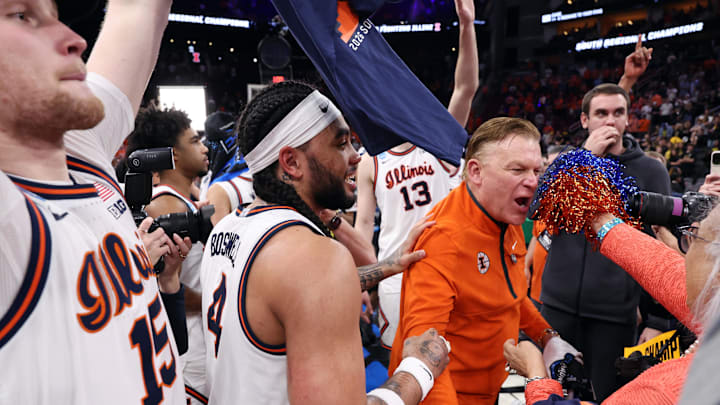 Mar 28, 2026; Houston, TX, USA; Illinois Fighting Illini head coach Brad Underwood celebrates with guard Kylan Boswell (4) after defeating the Iowa Hawkeyes in an Elite Eight game of the South Regional of the men's 2026 NCAA Tournament at Toyota Center. Mandatory Credit: Troy Taormina-Imagn Images