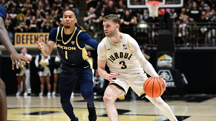 Nov 16, 2025; West Lafayette, Indiana, USA;  Purdue Boilermakers guard Braden Smith (3) dribbles the ball past Akron Zips guard Shammah Scott (1) during the second half at Mackey Arena. Mandatory Credit: Marc Lebryk-Imagn Images