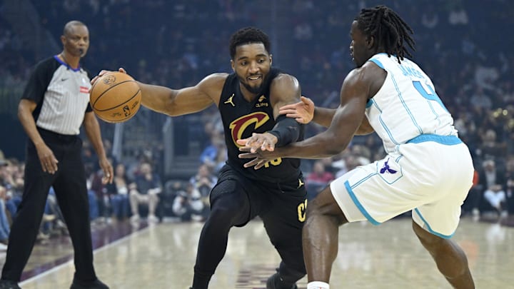 Dec 14, 2025; Cleveland, Ohio, USA; Cleveland Cavaliers guard Donovan Mitchell (45) dribbles against Charlotte Hornets guard Sion James (4) in the first quarter at Rocket Arena. Mandatory Credit: David Richard-Imagn Images Dec 14, 2025; Cleveland, Ohio, USA; Cleveland Cavaliers guard Donovan Mitchell (45) dribbles against Charlotte Hornets guard Sion James (4) in the first quarter at Rocket Arena. Mandatory Credit: David Richard-Imagn Images