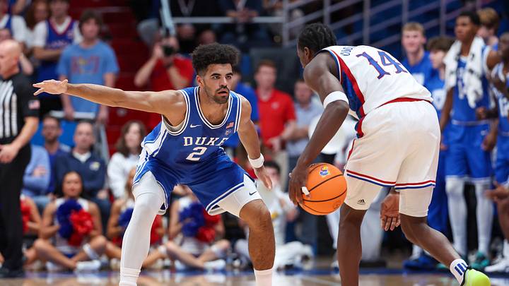 Oct 25, 2026; Lawrence, Kansas, USA; Duke Blue Devils guard Cayden Boozer (2) defends Kansas Jayhawks guard Melvin Council Jr. (14) during the first half at Allen Fieldhouse. Mandatory Credit: Scott Sewell-Imagn Images Oct 25, 2026; Lawrence, Kansas, USA; Duke Blue Devils guard Cayden Boozer (2) defends Kansas Jayhawks guard Melvin Council Jr. (14) during the first half at Allen Fieldhouse. Mandatory Credit: Scott Sewell-Imagn Images