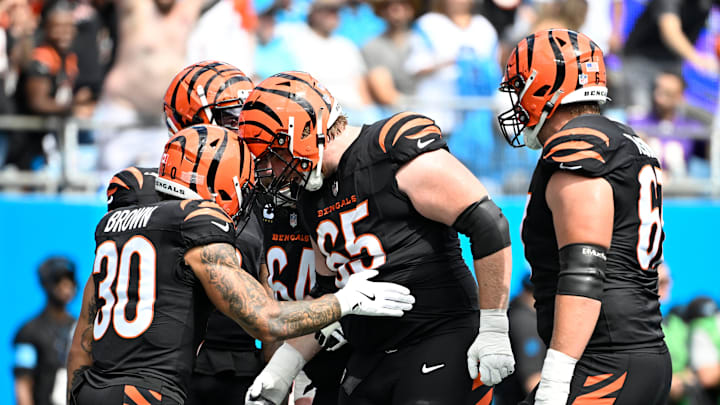 Sep 29, 2024; Charlotte, North Carolina, USA; Cincinnati Bengals running back Chase Brown (30) celebrates with guard Alex Cappa (65) after scoring a touchdown in the first quarter at Bank of America Stadium. Mandatory Credit: Bob Donnan-Imagn Images Sep 29, 2024; Charlotte, North Carolina, USA; Cincinnati Bengals running back Chase Brown (30) celebrates with guard Alex Cappa (65) after scoring a touchdown in the first quarter at Bank of America Stadium. Mandatory Credit: Bob Donnan-Imagn Images