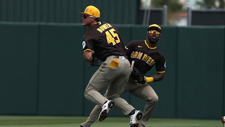 Mar 10, 2026; Tempe, Arizona, USA; San Diego Padres center fielder Jase Bowen (45) and second baseman Samad Taylor (0) avoid colliding against the Los Angeles Angels in the first inning at Tempe Diablo Stadium. Mandatory Credit: Rick Scuteri-Imagn Images