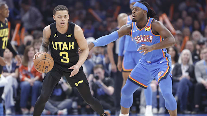 Mar 20, 2024; Oklahoma City, Oklahoma, USA; Utah Jazz guard Keyonte George (3) is defended by Oklahoma City Thunder guard Luguentz Dort (5) on a play during the first quarter at Paycom Center. Mandatory Credit: Alonzo Adams-Imagn Images