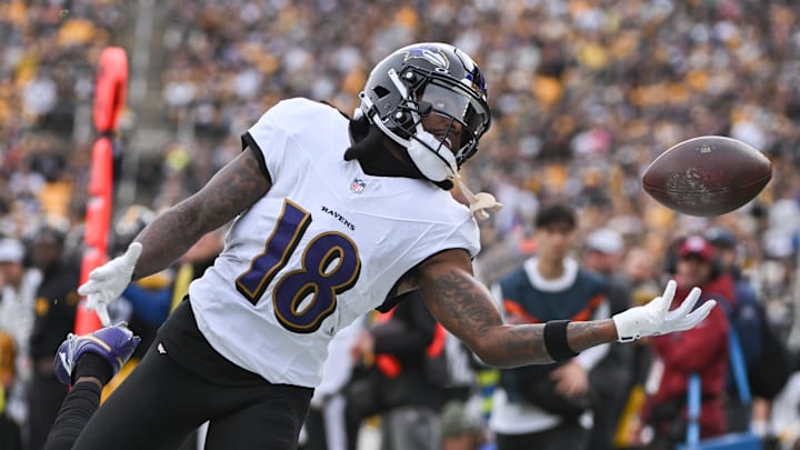 Nov 17, 2024; Pittsburgh, Pennsylvania, USA; Baltimore Ravens wide receiver Diontae Johnson (18) reaches for an incomplete pass against the Pittsburgh Steelers during the first quarter at Acrisure Stadium. Mandatory Credit: Barry Reeger-Imagn Images