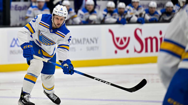 Jan 9, 2026; Salt Lake City, Utah, USA; St. Louis Blues defenseman Philip Broberg (6) makes a quick pass during first period against the Utah Mammoth at Delta Center. Mandatory Credit: Peter Creveling-Imagn Images