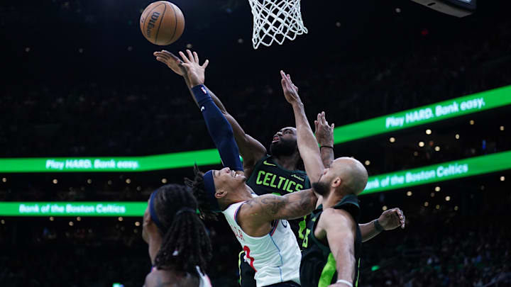 Nov 25, 2024; Boston, Massachusetts, USA: Boston Celtics guard Jaylen Brown (7) and guard Derrick White (9) defend against LA Clippers guard Jordan Miller (11) in the second half at TD Garden. Mandatory Credit: David Butler II-Imagn Images Nov 25, 2024; Boston, Massachusetts, USA: Boston Celtics guard Jaylen Brown (7) and guard Derrick White (9) defend against LA Clippers guard Jordan Miller (11) in the second half at TD Garden. Mandatory Credit: David Butler II-Imagn Images