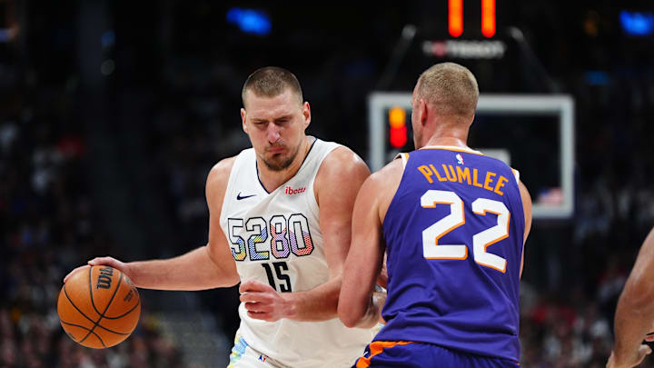 Dec 23, 2024; Denver, Colorado, USA; Phoenix Suns center Mason Plumlee (22) blocks Denver Nuggets center Nikola Jokic (15) in the second half at Ball Arena. Mandatory Credit: Ron Chenoy-Imagn Images Dec 23, 2024; Denver, Colorado, USA; Phoenix Suns center Mason Plumlee (22) blocks Denver Nuggets center Nikola Jokic (15) in the second half at Ball Arena. Mandatory Credit: Ron Chenoy-Imagn Images