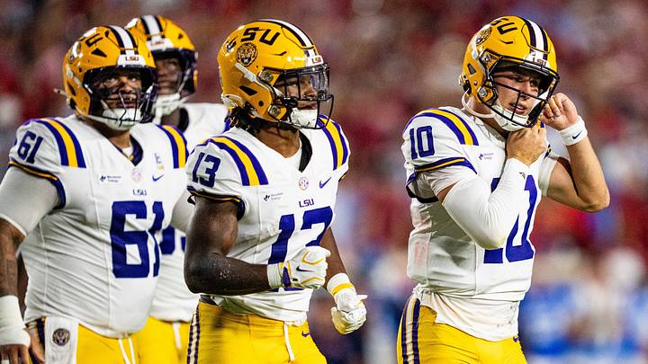 LSU quarterback Sam Leavitt adjusts his helmet. LSU quarterback Sam Leavitt adjusts his helmet.