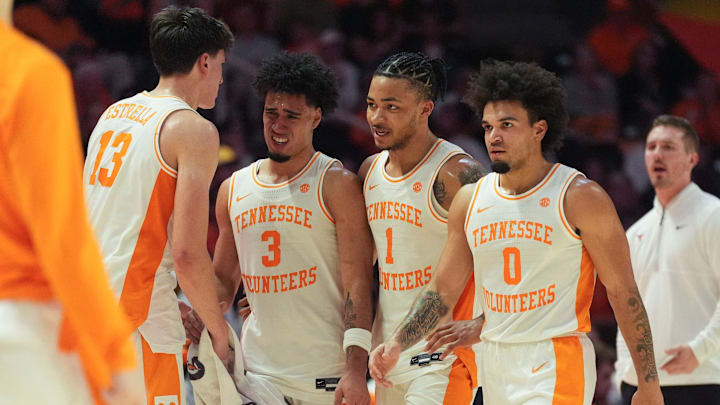 Tennessee forward J.P. Estrella (13) greets teammates Bishop Boswell (3), Amari Evans (1), and Ja’Kobi Gillespie (0) as they come off the court during a pause in the NCAA college basketball game between the Tennessee Volunteers and Texas Longhorns on January 6, 2026, in Knoxville, Tenn.